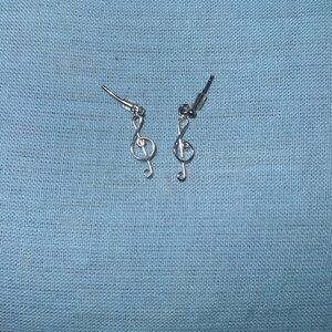 These are silver song note earrings.